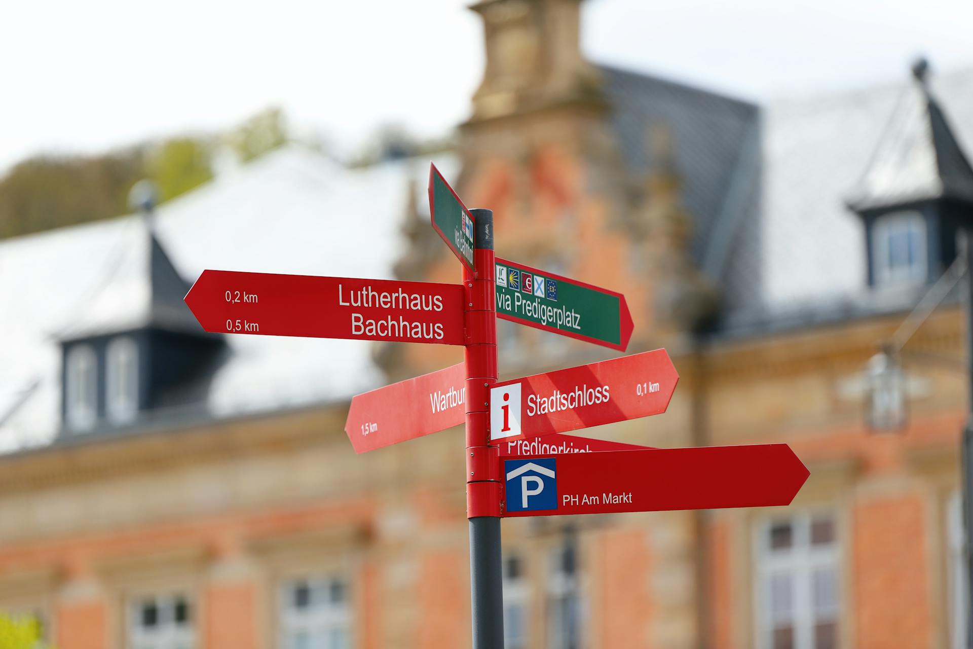 Multiple road signs pointing in different directions